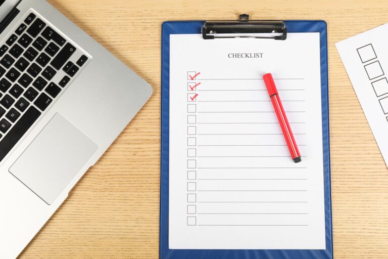 Completed checklist beside a laptop: WordPress maintenance checklist